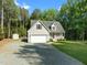 Charming single-Gathering home boasts a two-car garage, inviting front porch, and well-manicured lawn at 128 Madison Ct, Siler City, NC 27344