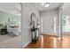 Traditional foyer with hardwood floors, coat rack and bedroom view at 128 Madison Ct, Siler City, NC 27344