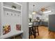 Spacious kitchen showcasing an island with stool seating, white cabinets and stainless steel appliances at 128 Madison Ct, Siler City, NC 27344