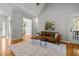 This is a bright room with a large rug and hardwood floors at 128 Madison Ct, Siler City, NC 27344