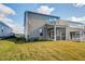Well-manicured backyard with green grass and a view of the home's exterior at 133 N Finley Landing Pkwy, Smithfield, NC 27577