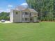 Expansive backyard featuring a lush green lawn, perfect for outdoor activities and relaxation at 1444 Old Apex Rd, Cary, NC 27513