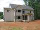 Two-story home shows the exterior, with a backyard that is ready for customization at 1444 Old Apex Rd, Cary, NC 27513