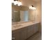 Bright bathroom features a double sink vanity with modern faucets and plenty of storage space at 1444 Old Apex Rd, Cary, NC 27513