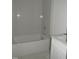 Bathroom featuring a bathtub and white cabinets at 1444 Old Apex Rd, Cary, NC 27513