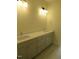 Elegant bathroom with dual vanity, offering generous counter space and modern lighting at 1444 Old Apex Rd, Cary, NC 27513