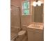 Luxurious bathroom with modern fixtures and a marble tiled shower at 1444 Old Apex Rd, Cary, NC 27513