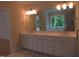 Spacious Primary bathroom with double vanity, large mirror, and soaking tub at 1444 Old Apex Rd, Cary, NC 27513