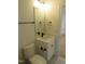 This bathroom has a white vanity with black hardware, a matching mirror and towel rack at 1444 Old Apex Rd, Cary, NC 27513