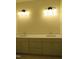 Bright bathroom with dual vanity and modern lighting fixtures, with ample counter space at 1444 Old Apex Rd, Cary, NC 27513