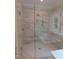 Elegant walk-in shower features glass enclosure and marble tiling, adding a spa-like experience at 1444 Old Apex Rd, Cary, NC 27513