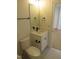 A half bathroom featuring a sleek white vanity, modern fixtures, a toilet, and light-colored walls at 1444 Old Apex Rd, Cary, NC 27513