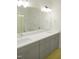 Bathroom featuring a double sink vanity with white countertop and gray cabinetry at 1444 Old Apex Rd, Cary, NC 27513