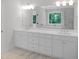 Elegant bathroom with double vanity, modern fixtures, and a large mirror for added light at 1444 Old Apex Rd, Cary, NC 27513
