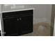 Elegant bathroom features a black vanity with a white countertop, ready for finishing touches at 1444 Old Apex Rd, Cary, NC 27513