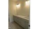 Bright bathroom with dual vanity and modern lighting fixtures, with ample counter space at 1444 Old Apex Rd, Cary, NC 27513