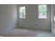 Unfinished bedroom with two bright windows offers a blank canvas for customization at 1444 Old Apex Rd, Cary, NC 27513
