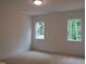 Bright, airy bedroom with plush carpeting and natural light from two windows at 1444 Old Apex Rd, Cary, NC 27513