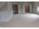 Bedroom has paneled walls, plush carpets, two closets, and neutral colors at 1444 Old Apex Rd, Cary, NC 27513