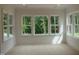 Bright, airy bedroom with large windows offering views of the backyard at 1444 Old Apex Rd, Cary, NC 27513