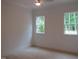 Bright, airy bedroom with large windows offering verdant views at 1444 Old Apex Rd, Cary, NC 27513