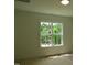 Light-filled bedroom with a window offering a view of lush greenery at 1444 Old Apex Rd, Cary, NC 27513