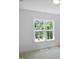 Bright bedroom with large window and view of trees at 1444 Old Apex Rd, Cary, NC 27513