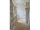 Walk-in closet with built-in shelving units at 1444 Old Apex Rd, Cary, NC 27513
