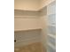 A bright closet with two wooden clothes racks and shelves on the right-hand side, with carpet floors at 1444 Old Apex Rd, Cary, NC 27513
