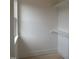A spacious walk-in closet with built-in shelving, providing ample storage at 1444 Old Apex Rd, Cary, NC 27513