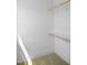 Bright closet with neutral carpet and wooden closet rods providing a highly functional storage solution at 1444 Old Apex Rd, Cary, NC 27513