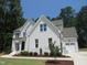 Attractive two-story home showcasing a brick facade, attached garage, and well-maintained landscaping at 1444 Old Apex Rd, Cary, NC 27513