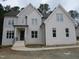 Stunning two-story white brick home with detailed trim and an inviting front porch at 1444 Old Apex Rd, Cary, NC 27513