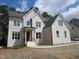 Charming two-story home with white brick and gabled roof at 1444 Old Apex Rd, Cary, NC 27513