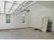 Spacious garage with natural light, providing a well-lit area for vehicles and projects at 1444 Old Apex Rd, Cary, NC 27513