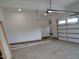 Spacious garage with an automatic door, and new flooring at 1444 Old Apex Rd, Cary, NC 27513