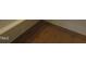 A close up on a new hardwood floor with bright white trim at 1444 Old Apex Rd, Cary, NC 27513