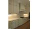 Gourmet kitchen featuring subway tile backsplash, stainless steel appliances, and custom cabinetry at 1444 Old Apex Rd, Cary, NC 27513