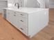 Kitchen island with stainless steel dishwasher, sink, storage, quartz countertop, and dark hardware at 1444 Old Apex Rd, Cary, NC 27513