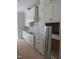 Close-up of the kitchen highlighting the custom cabinetry, sleek countertops, and modern appliances at 1444 Old Apex Rd, Cary, NC 27513
