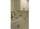The laundry room features white cabinets, modern countertops, and black hardware at 1444 Old Apex Rd, Cary, NC 27513