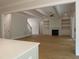 Inviting living room featuring a fireplace, custom shelving, and hardwood floors at 1444 Old Apex Rd, Cary, NC 27513