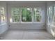 Bright living room with large windows offering wooded views at 1444 Old Apex Rd, Cary, NC 27513