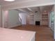 Open living room with built-in shelving, a fireplace, and large sliding doors for natural light and indoor-outdoor living at 1444 Old Apex Rd, Cary, NC 27513