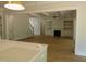 Open-concept living room with fireplace, built-in shelves, and hardwood floors at 1444 Old Apex Rd, Cary, NC 27513