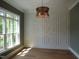 Sunlit living room with wainscoting and large window at 1444 Old Apex Rd, Cary, NC 27513