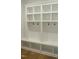 Built-in mudroom with storage, hooks, and a bench for organization at 1444 Old Apex Rd, Cary, NC 27513