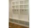 Well-organized mudroom features built-in shelving with hooks and bench seating with storage space at 1444 Old Apex Rd, Cary, NC 27513