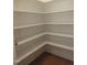 Walk-in pantry features open shelving providing ample storage space at 1444 Old Apex Rd, Cary, NC 27513