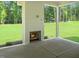 Covered patio featuring a brick fireplace, perfect for outdoor entertaining at 1444 Old Apex Rd, Cary, NC 27513